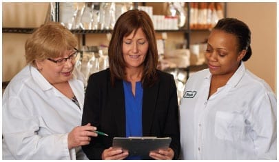 Food scientists consulting with customer