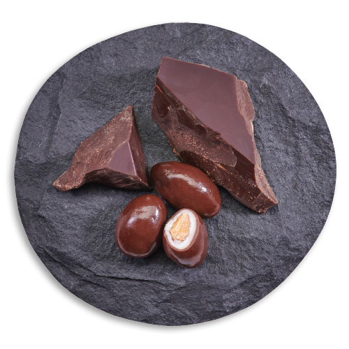 chocolate coated, yogurt covered almonds next to chunks of chocolate
