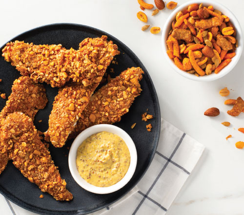 Crunchy Chicken Tenders hand coated with our spicy party mix